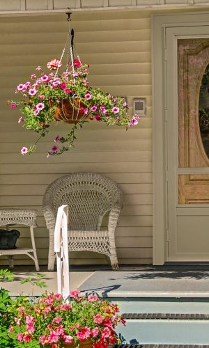 House porch with wicker furniture and flowers